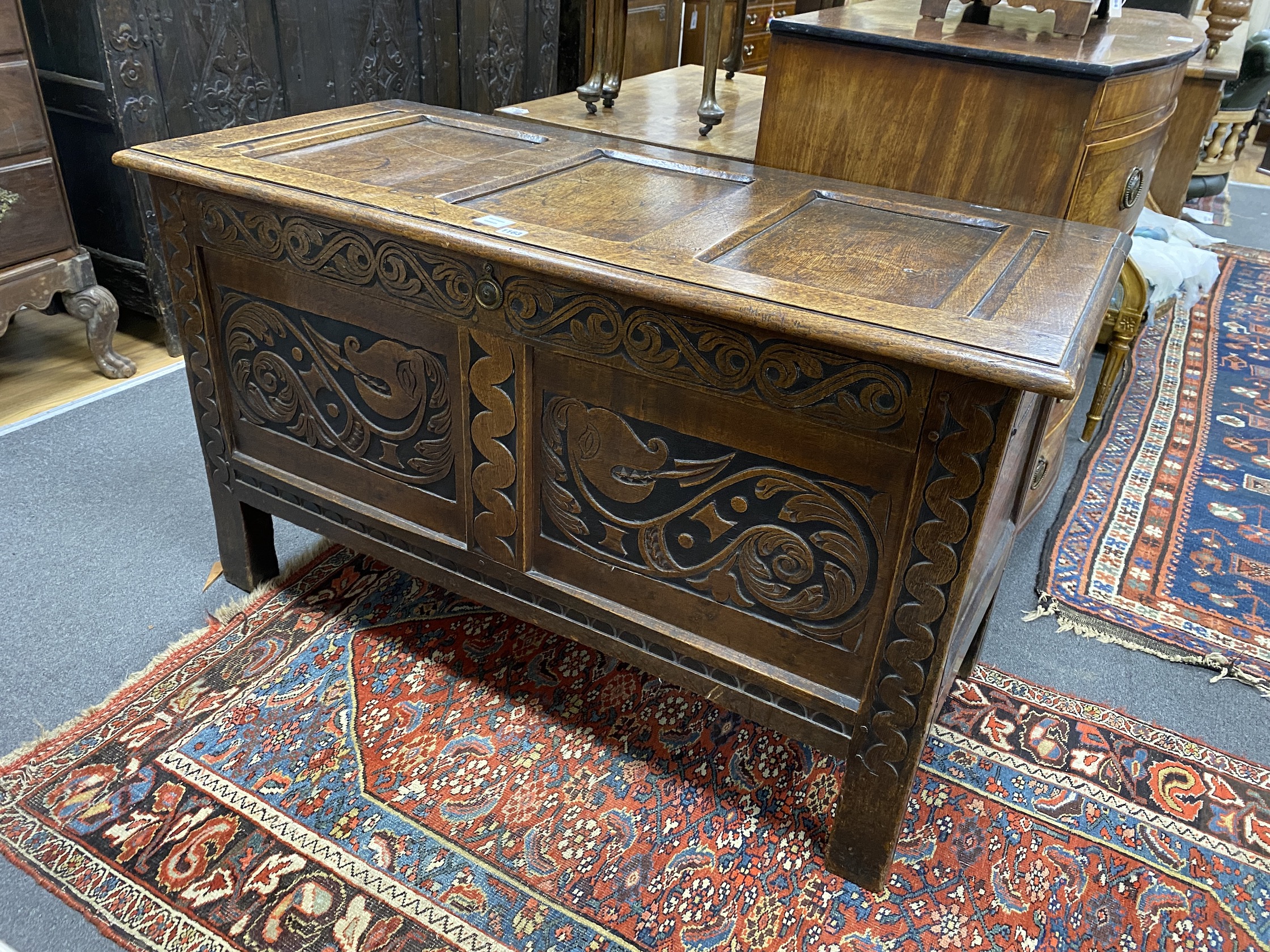 An 18th century panelled oak coffer, length 124cm, depth 56cm, height 73cm